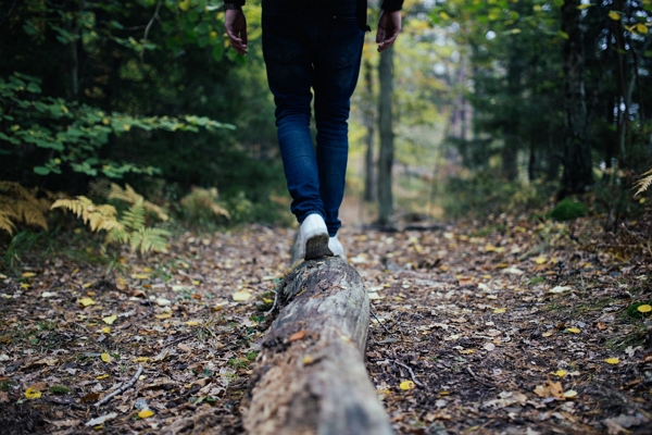 Someone walking on a log