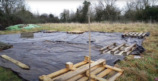 Black polythene cover on a field to convert to no dig garden