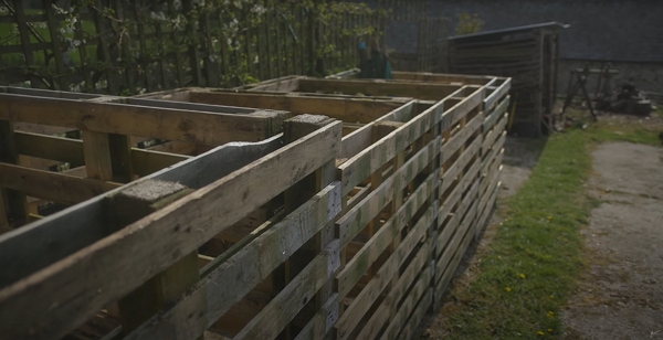 Empty pallet compost bins