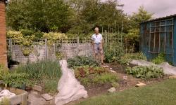 Charles standing in the small garden