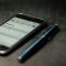 A smartphone and a pen on a desk