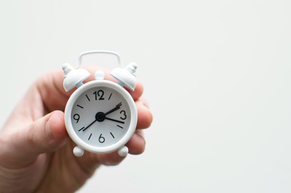 A clock in the hand of someone