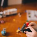 A kid building something with LEGO blocks.