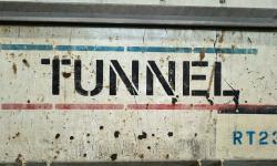 “Tunnel” written on a metal structure