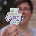 A sticker saying, “Get me you some API, now.”