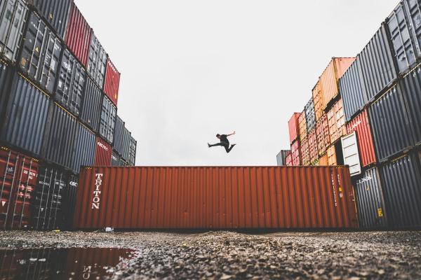 A man jumping on a container