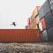 A man jumping on a container