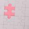 A single puzzle piece separated from the rest of the picture