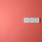 Keys A-L-T aligned on salmon-color background